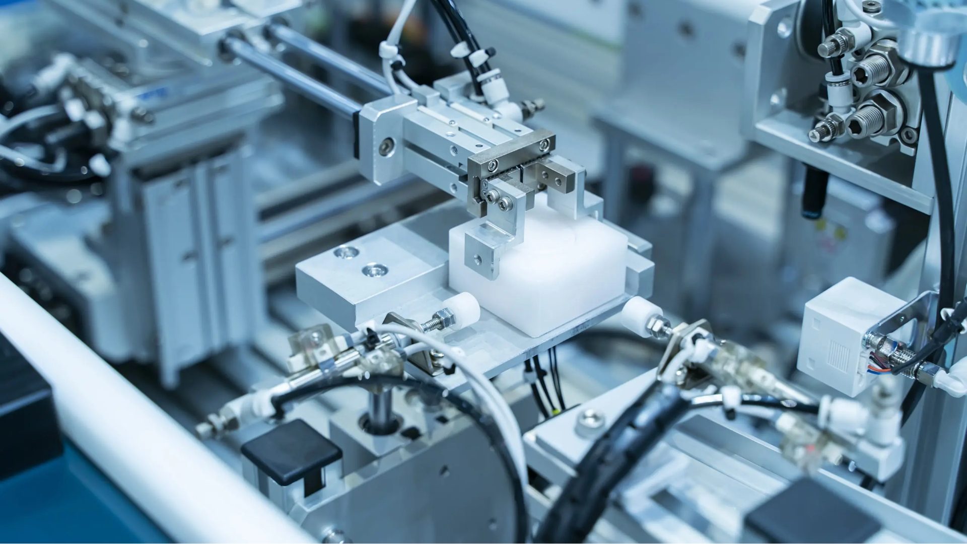 Pneumatic gripper used in automated assembly line handling stations