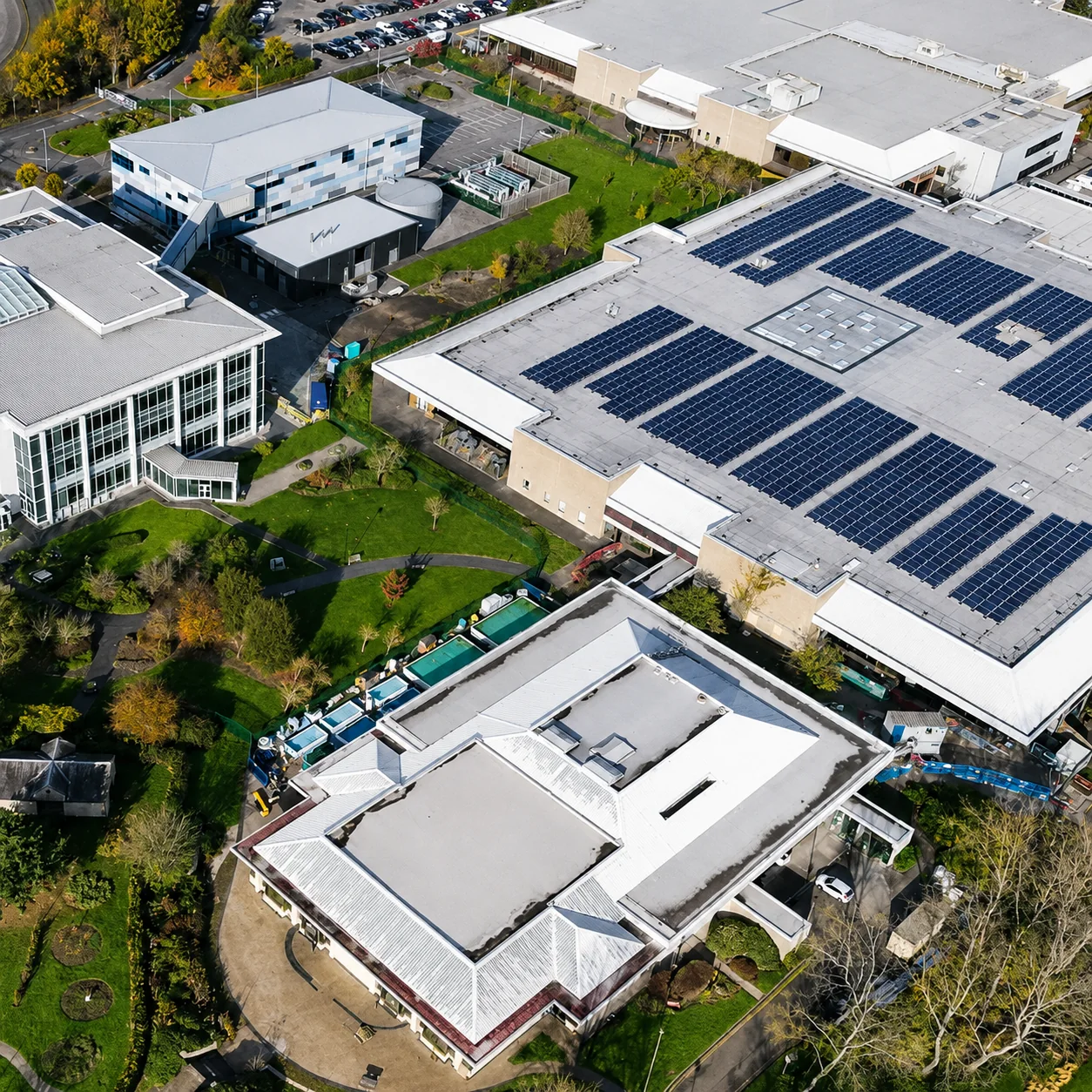 Aerial view of an industrial site with rooftop solar panels representing a responsible material supply chain
